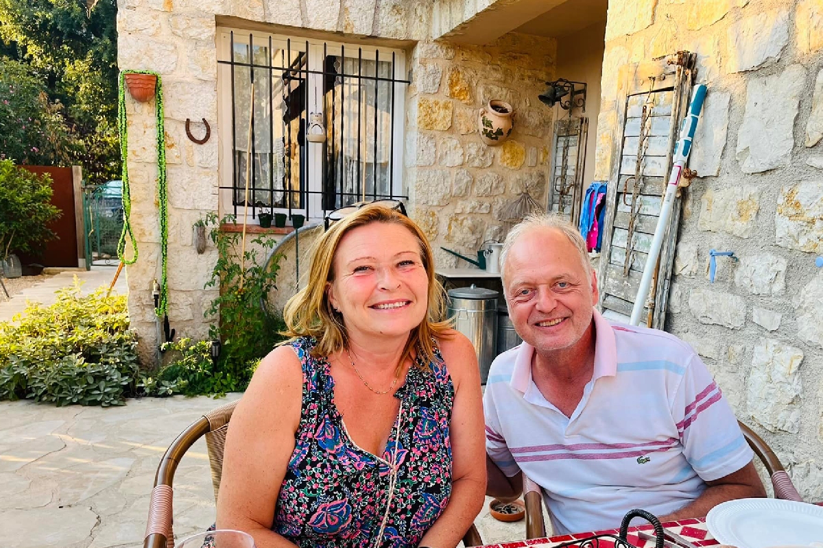 Bent and Iwona Bjerre in front of their villa